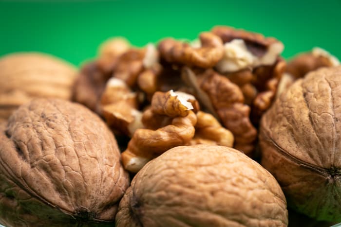 Unshelled walnut chunks closeup